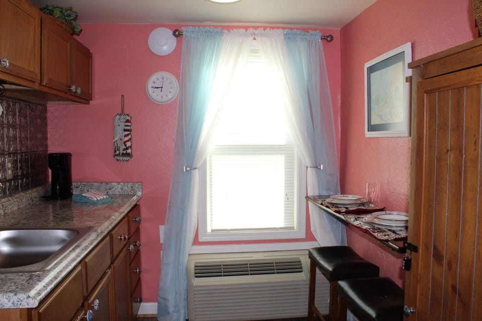 Window is on side of building and looks out to beautiful white sand beaches! 