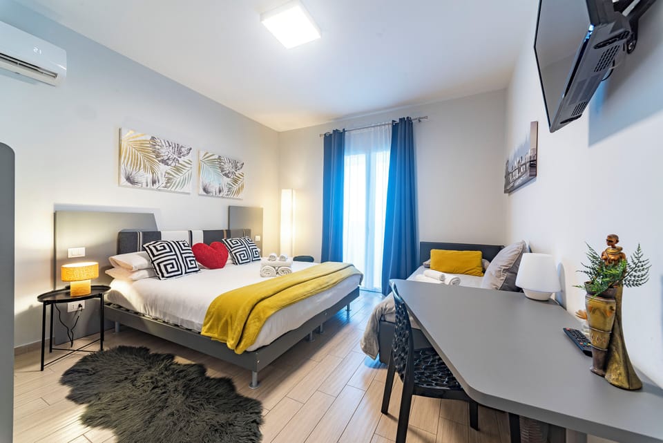 Triple Room, Terrace | Individually furnished, desk, free WiFi, bed sheets