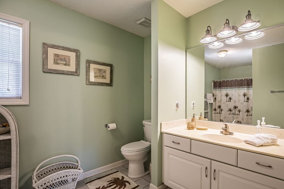 Bath to fourth bedroom ensuite with shower