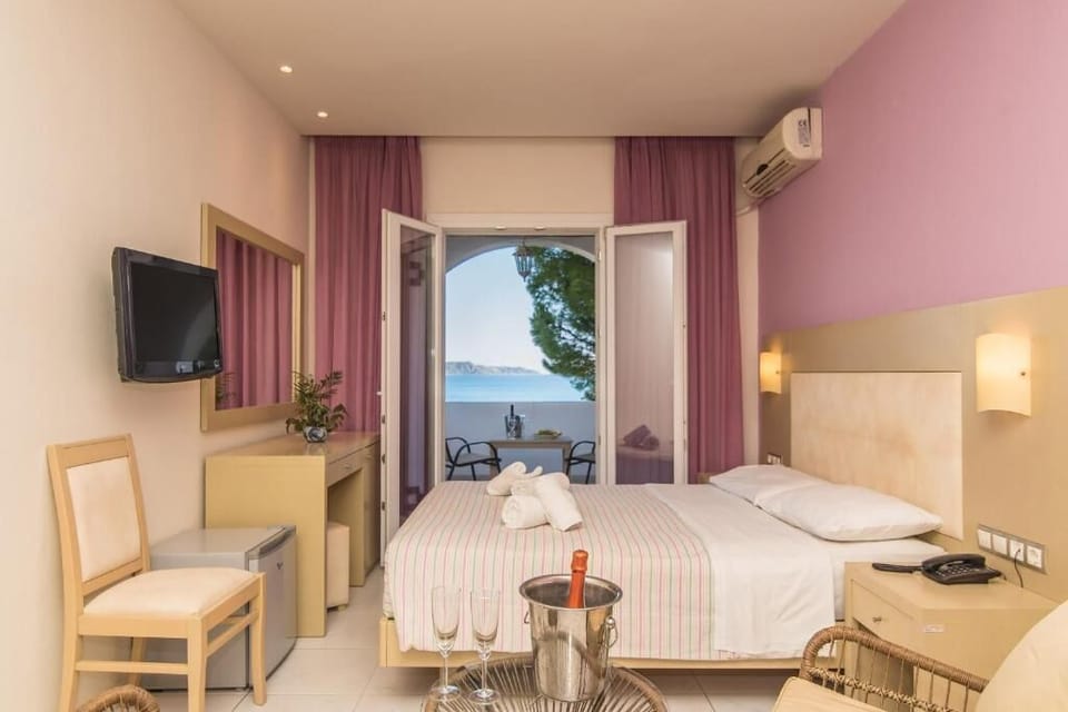 Standard Room, Sea View | Minibar, in-room safe, free WiFi, bed sheets
