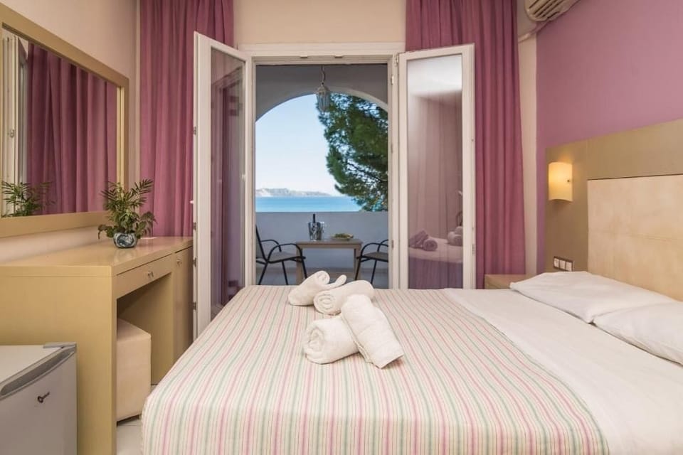 Standard Room, Sea View | Minibar, in-room safe, free WiFi, bed sheets