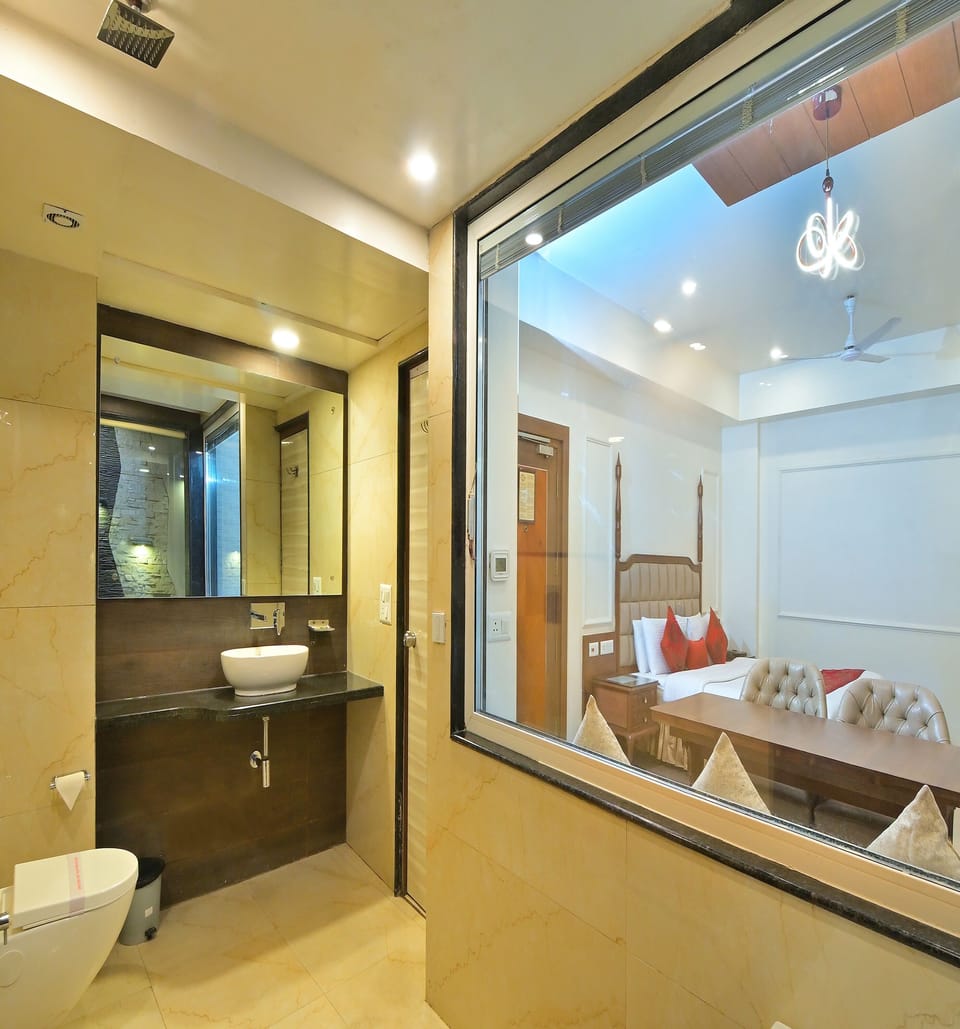 Suite Room With Bathtub | Bathroom | Shower, rainfall showerhead, towels, soap