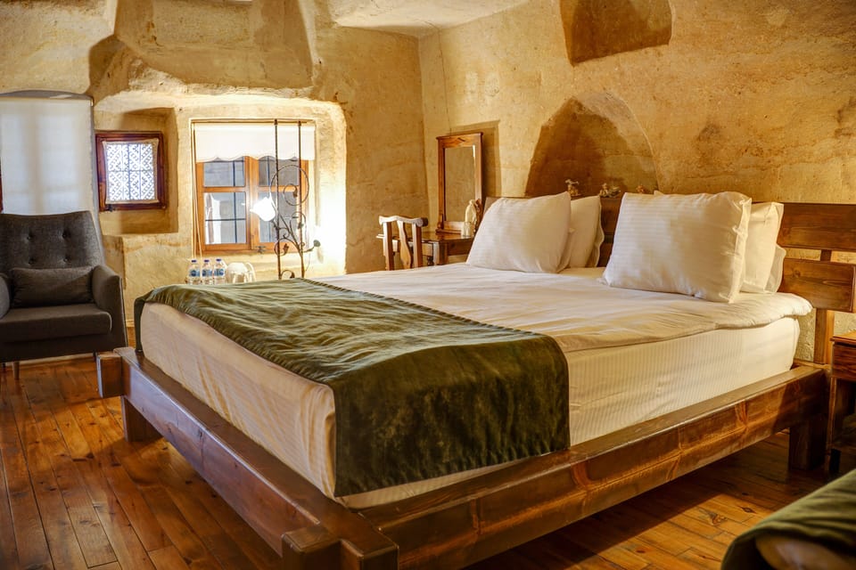 King Cave Suite | Egyptian cotton sheets, premium bedding, memory foam beds, minibar