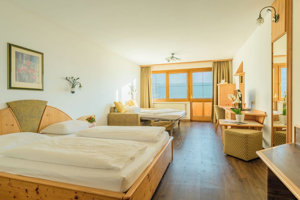Family Room, Balcony | Minibar, in-room safe, desk, soundproofing