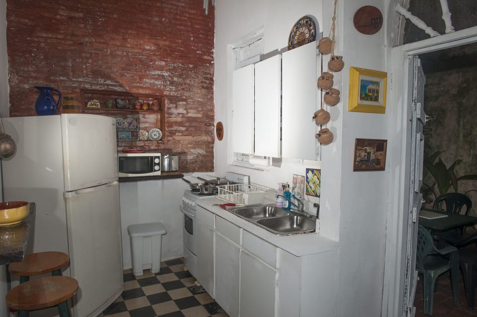 Kitchen with entrance to patio to right of frame 