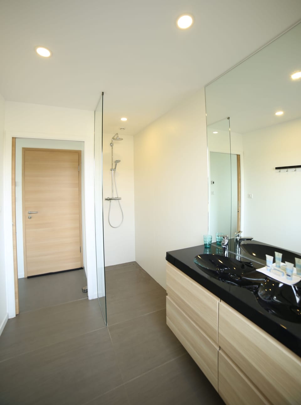Shower, rainfall showerhead, hair dryer, towels