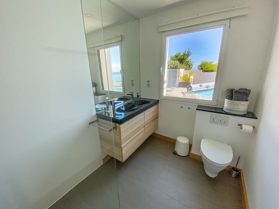 Shower, rainfall showerhead, hair dryer, towels