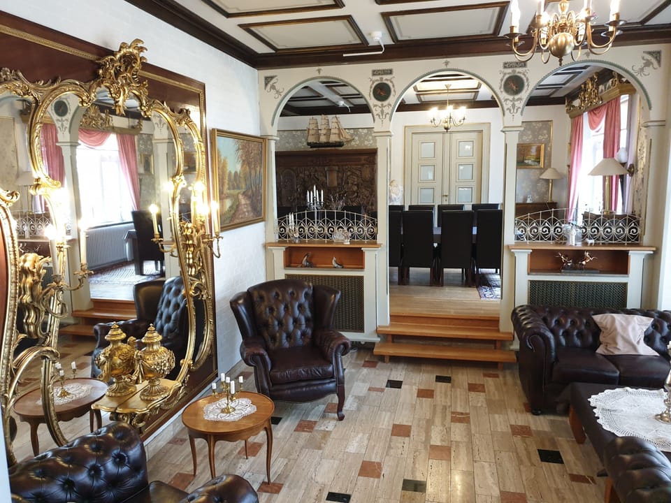 Royal Apartment | Living area | 32-inch flat-screen TV with cable channels, TV