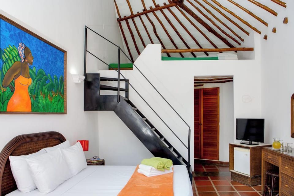 Family Quadruple Room, Garden View | Minibar, in-room safe, desk, free WiFi
