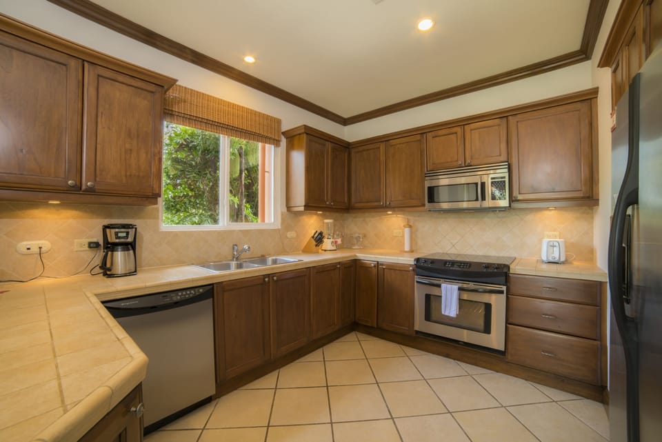 Condo, Multiple Beds, Non Smoking | Private kitchen | Coffee/tea maker, full-size fridge, microwave, oven