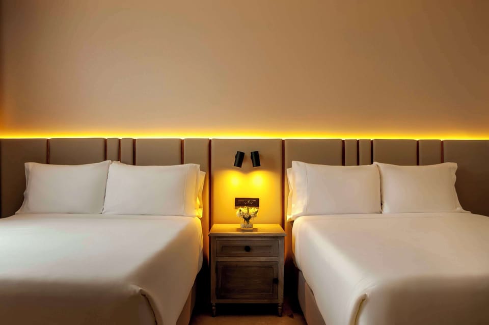Family Quadruple Room | Premium bedding, minibar, in-room safe, iron/ironing board