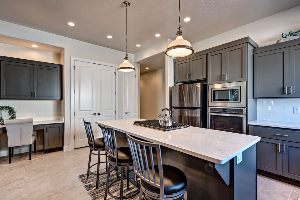 Side View of Kitchen - Side view of kitchen showing off the beautiful counter tops and stainless-steel appliances.