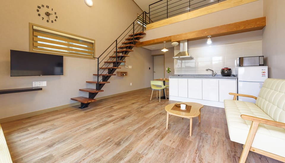 Duplex (#302) | Living area | Flat-screen TV