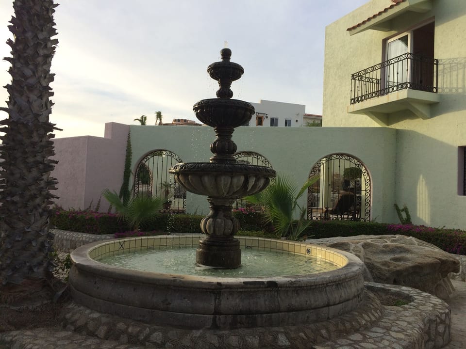 In Spanish, fountain is 'fuente.' Casa Fuente is in the background of the photo.