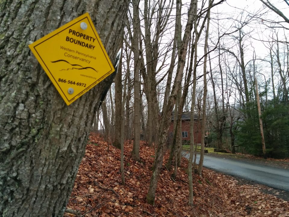 surrounded by conservation land