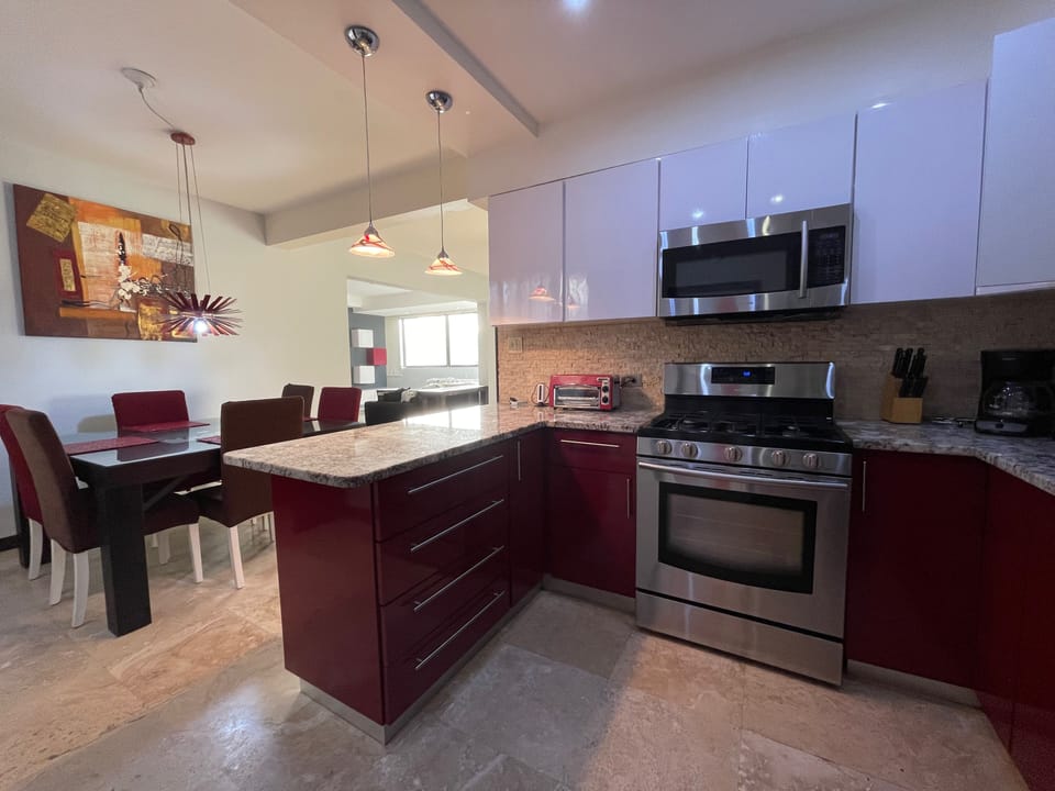 Full size kitchen stainless steal appliances, utensils & cookware, dining table