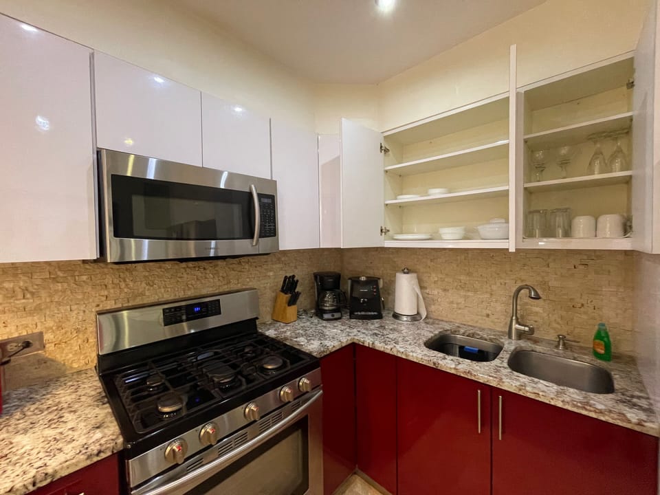 Full size kitchen stainless steal appliances, utensils & cookware, dining table