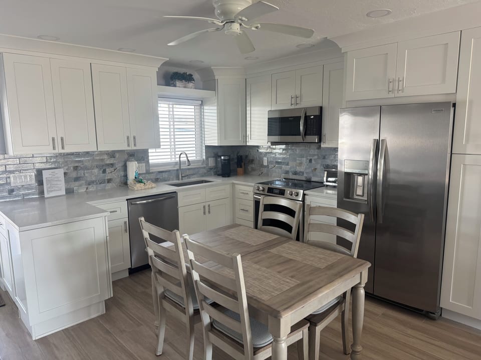 Kitchen / Dining area with expandable table to accommodate six people.