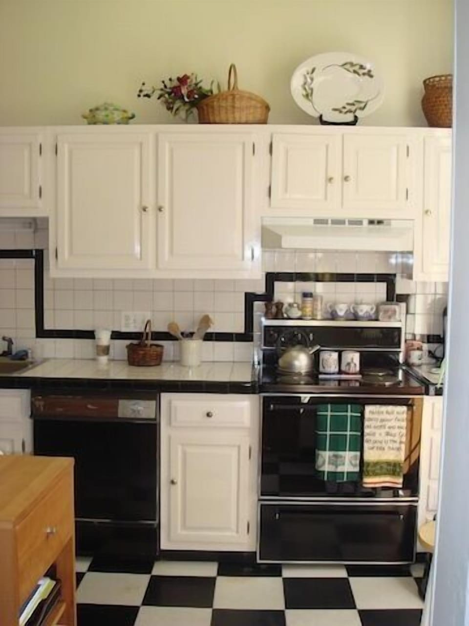 Large, fully applianced kitchen with small area to eat in.