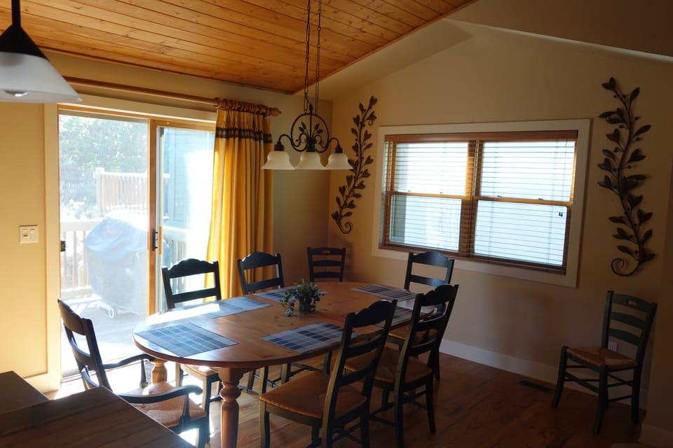 Dining room opens to deck with gas grill.