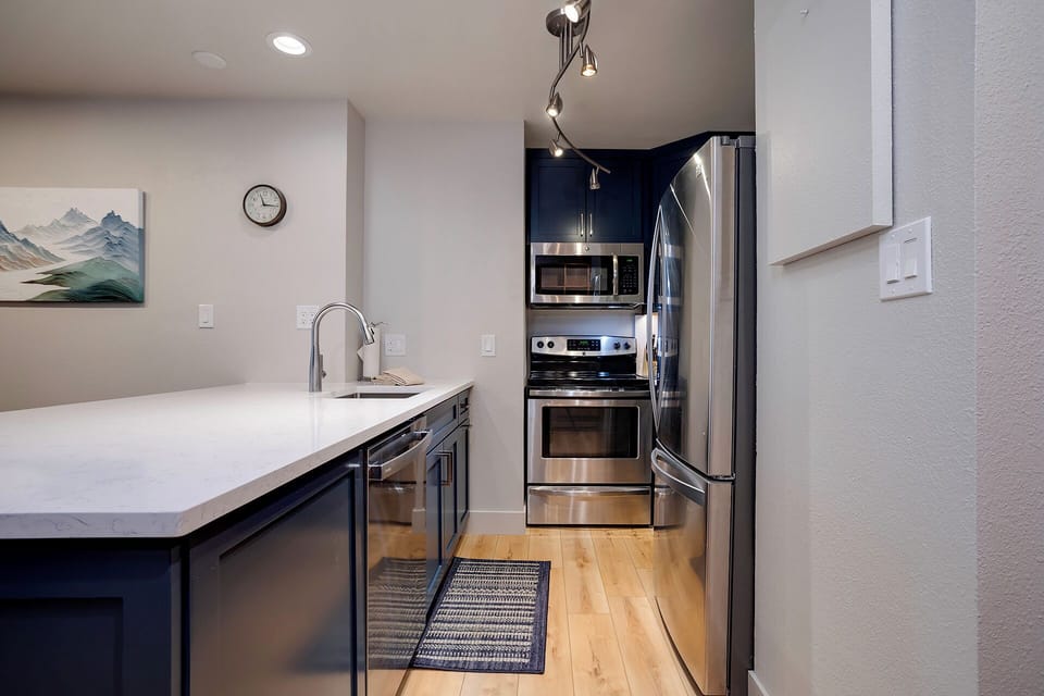 Your modern kitchen features stainless steel appliances and spacious counters, perfect for preparing memorable meals during your stay.