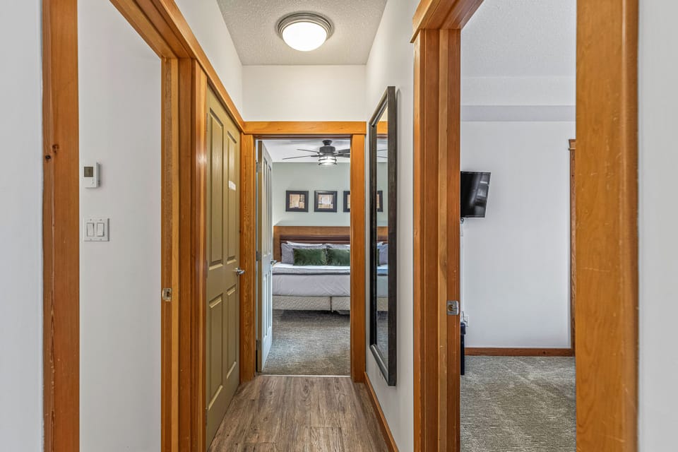 Unit 1:  View down hallway to the bedrooms and the Main Bath. 