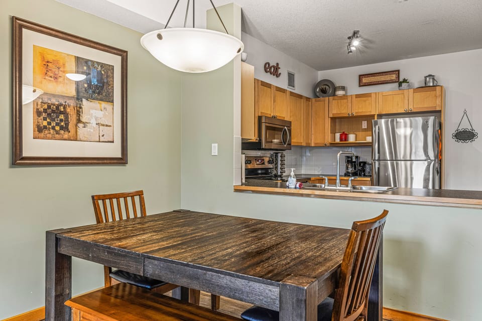 Unit 1:  Dining Room open to Fully-Stocked Kitchen. 