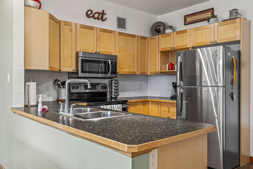 Unit 1:  Fully Stocked Kitchen w/Stnls Steel Appliances. 