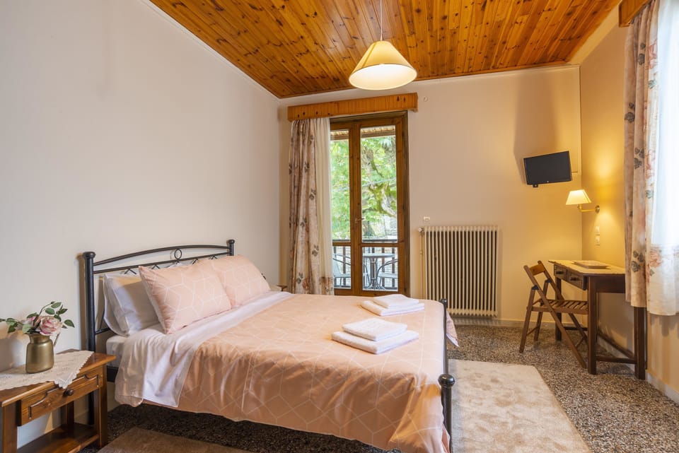 Economy Double Room | Down comforters, pillowtop beds, blackout drapes, iron/ironing board