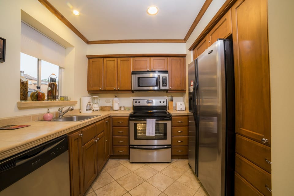 Deluxe Condo, 1 King Bed with Sofa bed (Los Suenos Resort Veranda 5A) | Private kitchen | Coffee/tea maker, full-size fridge, microwave, oven
