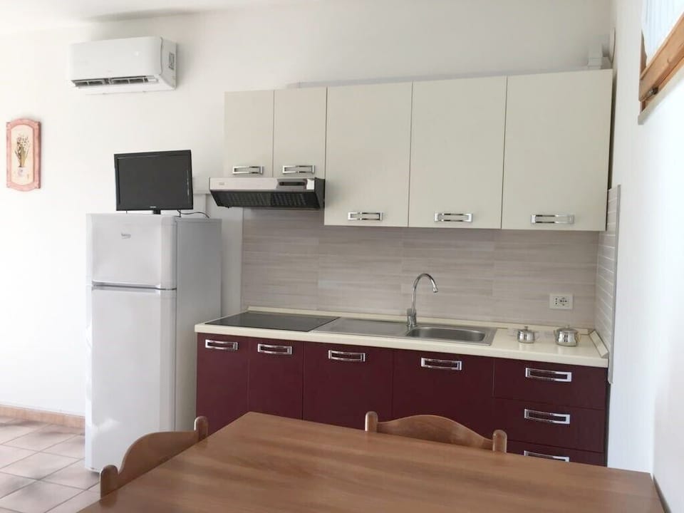 Basic Apartment, 1 Bedroom | Private kitchen | Fridge, stovetop, highchair, cookware/dishes/utensils