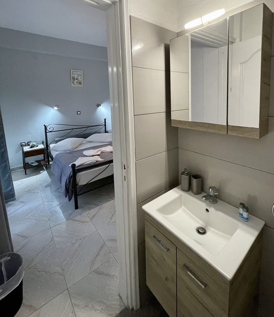 Shower, free toiletries, hair dryer, slippers