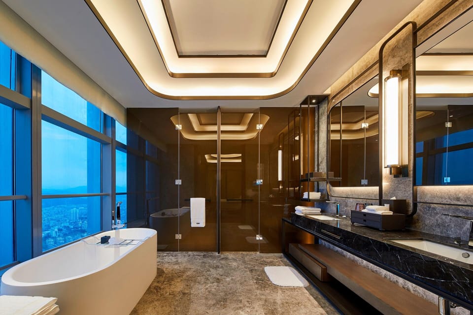 Deep soaking tub, rainfall showerhead, hair dryer, slippers