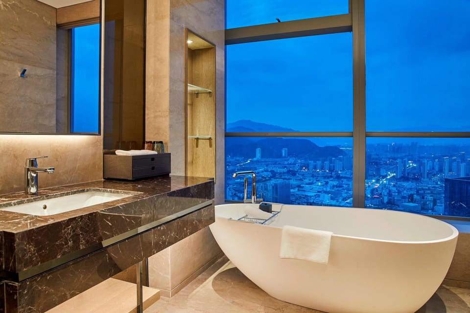 Deep soaking tub, rainfall showerhead, hair dryer, slippers