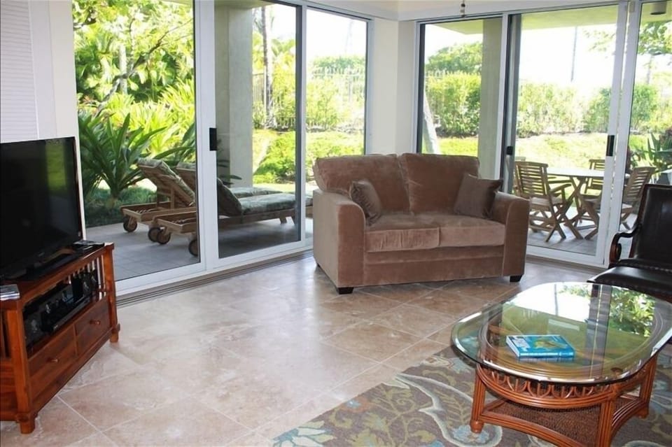 Bright Ground Floor With Lush Tropical Vegetation.  Walk Off Lanai To Pool.
