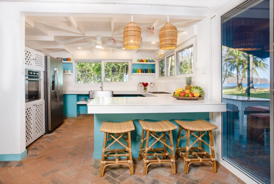 Full equipped kitchen with extra seating at the breakfast bar.