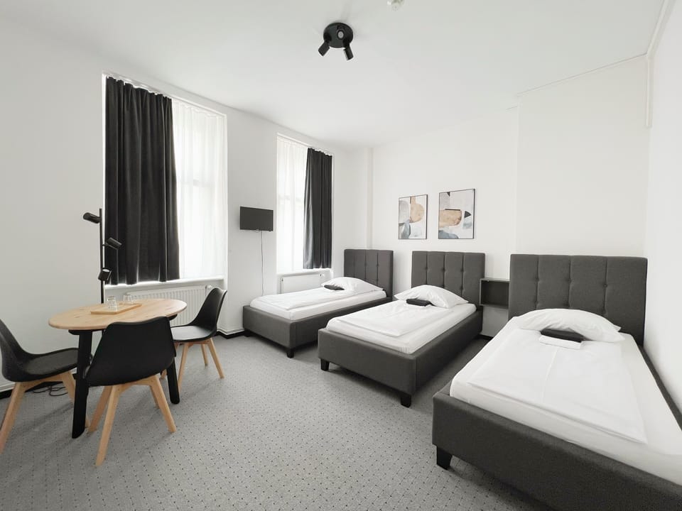 Triple Room, Shared Bathroom | Desk, free WiFi