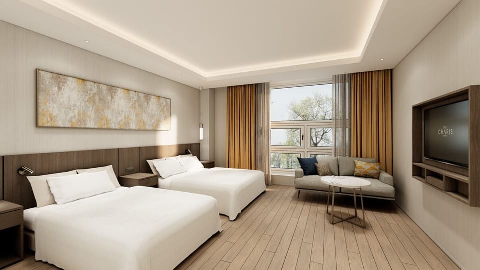 Deluxe Twin Room | Down comforters, in-room safe, individually decorated
