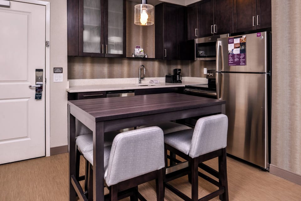 Desk, laptop workspace, blackout drapes, iron/ironing board