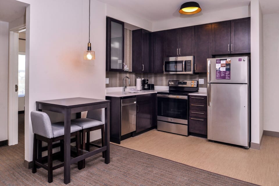 Suite, 1 Bedroom | Desk, laptop workspace, blackout drapes, iron/ironing board