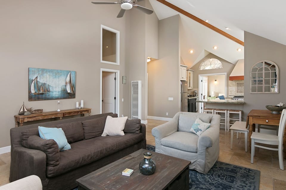 Living Room Looking into the Kitchen and Den - Open Beam Ceilings Throughout!