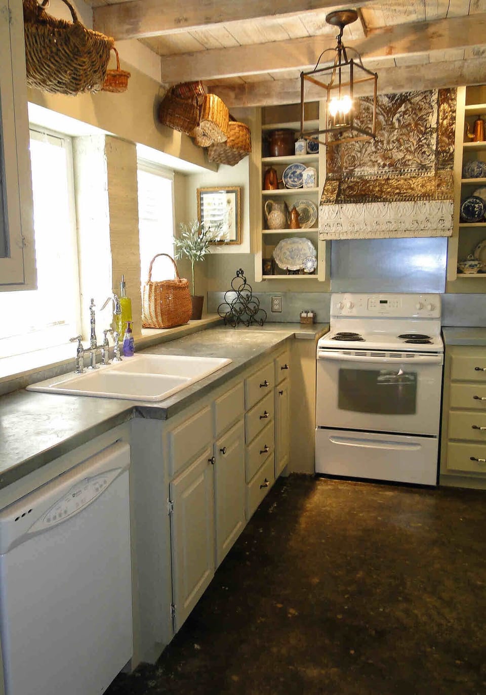 Full kitchen amenities: stove, range,refrigerator with freezer and ice maker.