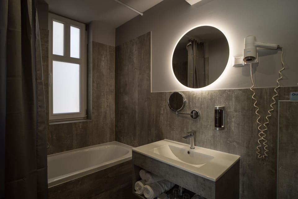 Quadruple Room with Air Conditioner | Bathroom | Shower, hair dryer, towels