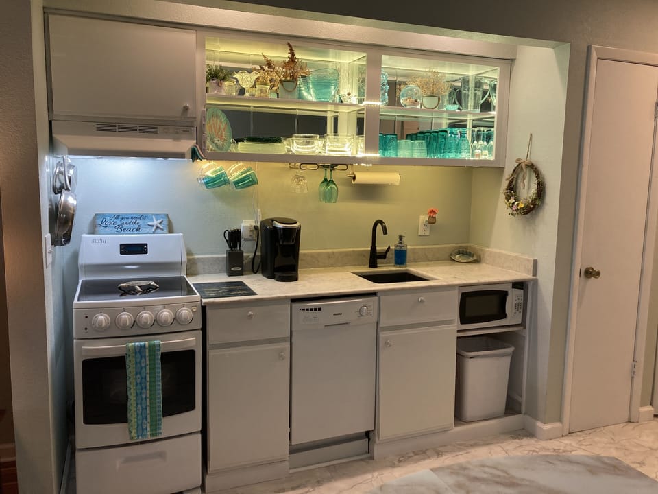 Beautiful new white, bright flooring and kitchen