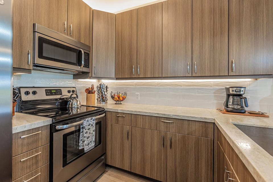 Spacious kitchen with granite counters and stainless appliances