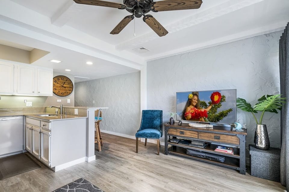 Living area with television and chair.