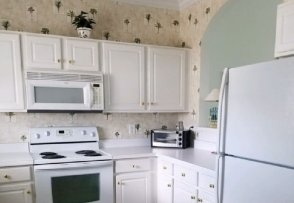 Kitchen off entryway - dishes, pots/pans, small appliances, garbage disposal etc
