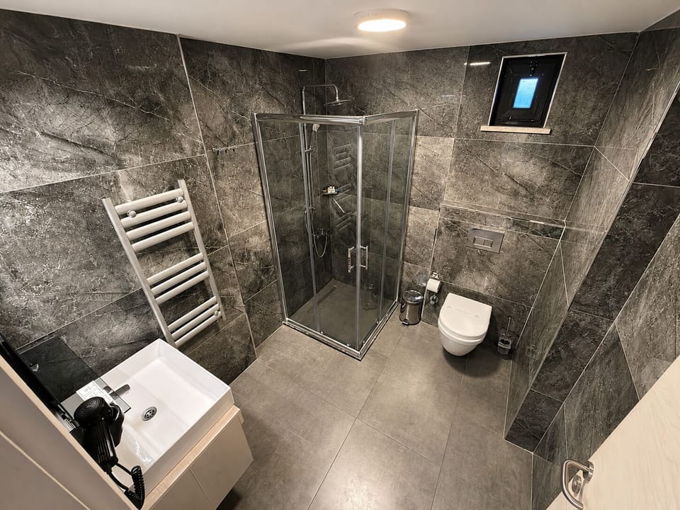 Shower, rainfall showerhead, eco-friendly toiletries, hair dryer