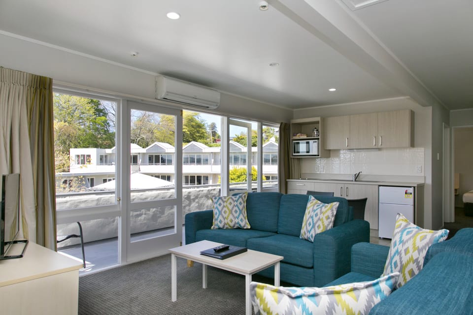 Deluxe Apartment, 1 Bedroom, Lake View | Living area | 42-inch Smart TV with digital channels, TV, Netflix
