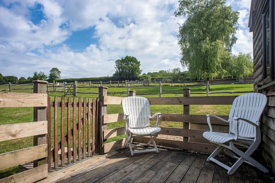 Reclinable chairs by gate to private garden